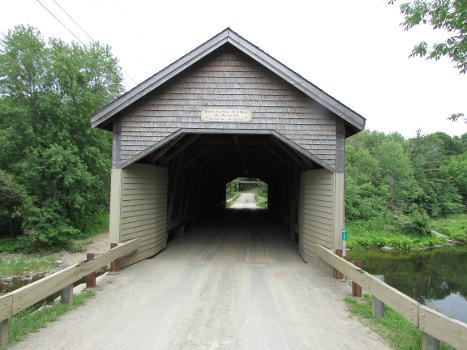 RobyVille Bridge crosses the Kenduskeag Stream in the town of Corinth, Maine:It is the oldest surviving example of a Long truss covered bridge in the state.