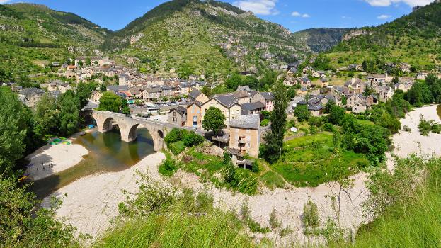 The little village of Sainte-Enimie (Lozère, France) at the entrance of the Gorges du Tarn, seen from a picnic area on D986 road