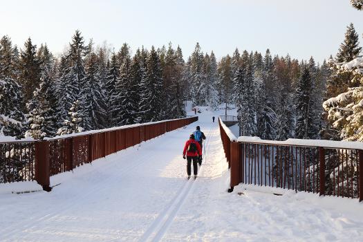 Skiing on the pedestrian bridge Sudentassu in Vantaa, Finland