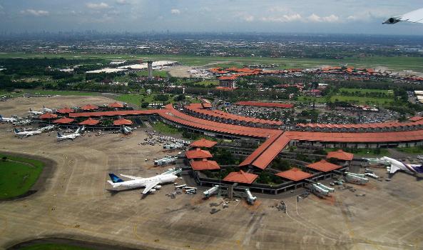 Aerial view of Soekarno-Hatta International Airport, Jakarta : View taken in 1 February 2010 from Garuda Indonesia airplane during take-off. The architecture reflect Indonesian vernacular architecture of Javanese Joglo roof with Pendopo as gate lounges (waiting hall) surrounded with tropical gardens.
