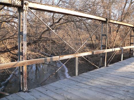 Diagonal members of east truss, Sweetwater Mill Bridge in Buffalo County, Nebraska:The pin-jointed Pratt pony truss bridge carries Sweetwater Road across Mud Creek. It was built in 1909 by the Standard Bridge Company, and is listed in the National Register of Historic Places.