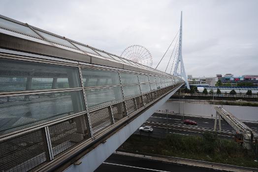 Teleport Bridge is a covered suspension bridge for pedestrians crossing the highway in Tokyo