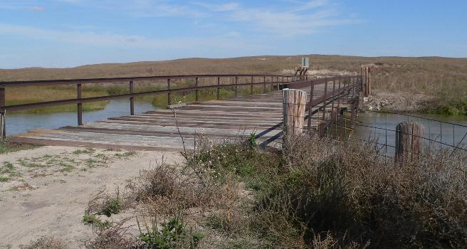 Twin Bridge:Twin Bridge, carrying a minimm-maintenance county road across the North Loup River northwest (upstream) of Brownlee, Nebraska; seen from the south bank.