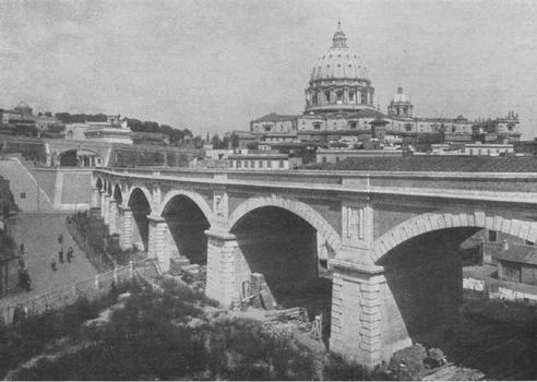 Eight-span viaduct carrying the Vatican Railway over the Gelsomino valley up to the sliding-door gateway into Vatican precincts. St. Peter's in the background. Uncredited photograph from The Railway Magazine (1934)