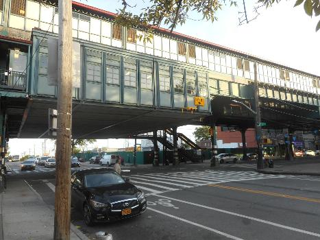 Looking southeast at the Wakefield-241st Street Elevated Railway Terminal from the northwest corner of White Plains Road and 241st Street:Located in the Wakefield section of the North Bronx, New York City. The station is the northern terminus of the train, as well as the IRT White Plains Road Line, and the system in general. Note also the 12'8" low clearance sign under the station house.