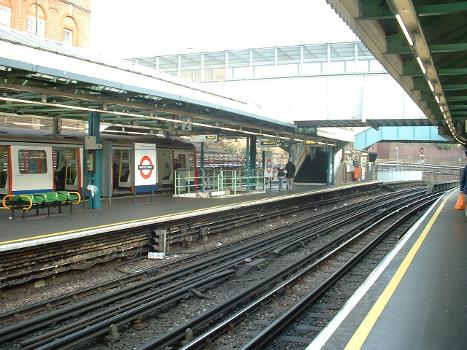 Looking east at Whitechapel tube station, with Hammersmith &amp; City line train in northernmost platform