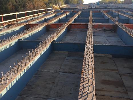 John Greenleaf Whittier Bridge : The contractor exposes the steel structural supports beneath the deck of the I-95 South bridge over Route 110.