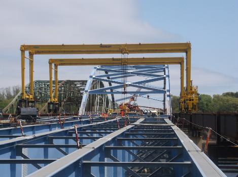 John Greenleaf Whittier Bridge:Crews use the traveling gantry crane (yellow) to erect steel girders on the southern end of the new Whittier Bridge in Newburyport.