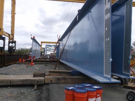John Greenleaf Whittier Bridge:Roughly 100-foot long steel girders, staged on timbers, will be installed on the Newburyport approach spans of the new Whittier Bridge. The entire span, from Newburyport to the arch, is 560 feet.
