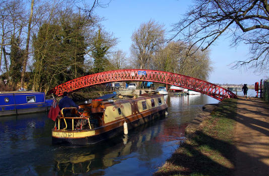 Narrowboat on the River Thames passing under Medley Footbridge, Binsey, Oxfordshire