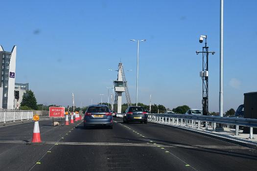 The Myton Bridge in Kingston upon Hull, viewed from the eastbound carriageway : New barriers and LED lighting have been installed, while work is nearly complete to convert the bridge from two to three lanes.
N.B. The dust specs on the photographs are not on the photograph itself, but are the byproducts of dirt on my car windshield.