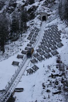 Steep funicular railway up to village Stoos (Switzerland), winter 2017-2018 in Europe with snow.