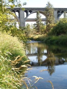 The Sunset Highway, Interstate 90 and railroad bridges over Latah Creek, as seen from just downstream : High Bridge Park lies on the opposite side of the water as where the photo was taken. September 2012.