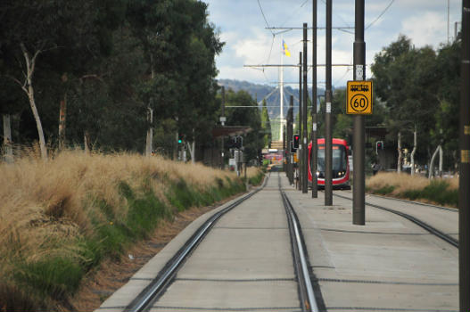 Canberra light rail stage 1 featuring a CAF Urbos 3 vehicle or tram towards City Hill and Australian Parliament House