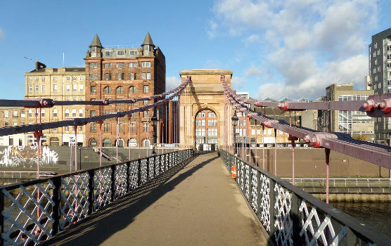 The 414ft Carlton Suspension Bridge of 1853 over the River Clyde, Glasgow, Scotland.