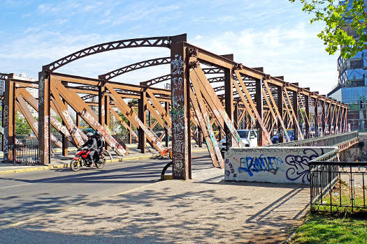 Rusty bridge that crosses the Mapocho River