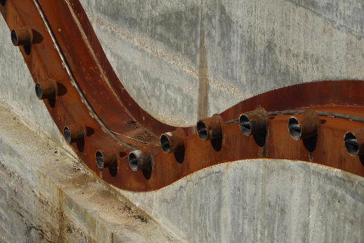 Detail of the Cody Dock Rolling Bridge designed by Thomas Randall-Page : The square cog design, rolling on catenary curve tracks - together with a balanced centre of gravity - enables the bridge to be rolled between higher and lower positions with minimum effort.