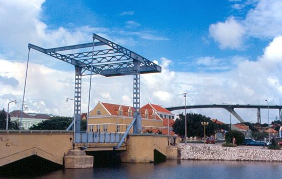A Dutch-style lift bridge, built with modern materials, connecting Punda (the center of Willemstad) with Scharloo.