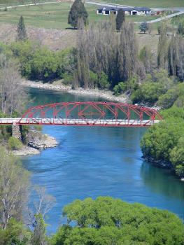 Earnscleugh Bridge on Fruitgrowers Road, Clyde, Central Otago, New Zealand. New Zealand Historic Places Trust Register number . The current steel through truss bridge was built in 1935 on the stone piers of the 1876 suspension bridge which was twice washed away by floods.