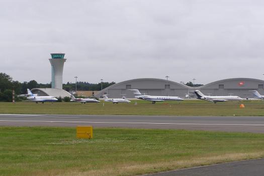 A line-up of business jets at Farnborough Airfield, England