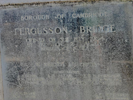 The faded plaque says the bridge was opened on 31 July 1964 by and lists the names of the mayor and councillors