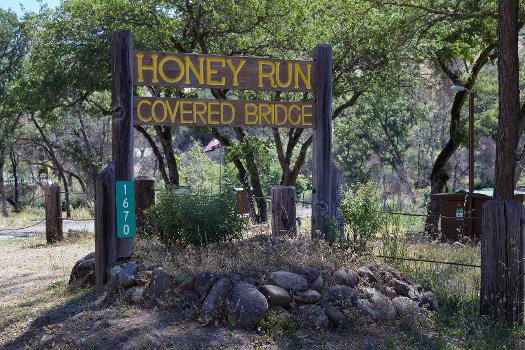 Signage at the Honey Run Covered Bridge in Butte Creek Canyon : Honey Run Covered Bridge was a wooden covered bridge crossing Butte Creek, in Butte County. It was destroyed in the Camp Fire on November 8, 2018.