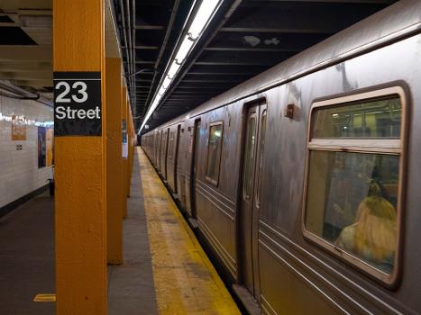 The northbound platform of the IND Eighth Avenue Line's 23rd Street station with an R46 C train departing