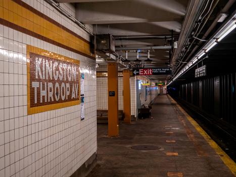 Southbound platform of the IND Fulton Street Line's Kingston-Throop Avenues station : Note how the way the mosaic H was made makes it look upside-down.