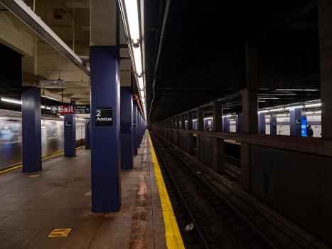 A view over the middle tracks from the northbound platform of the IND Sixth Avenue Line's 2nd Avenue station. An R160 F train is departing
