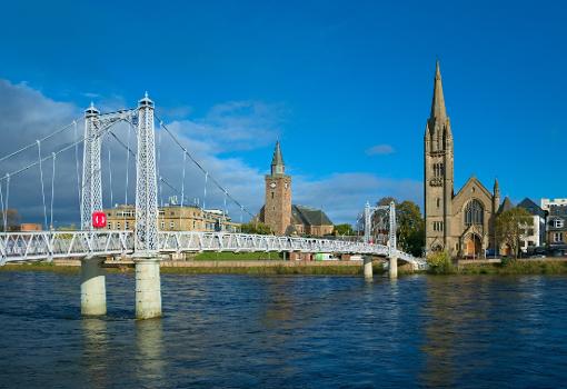 The Greig Street pedestrian bridge in Inverness, with the Free North Church and Old High Church on the other side of river Ness
