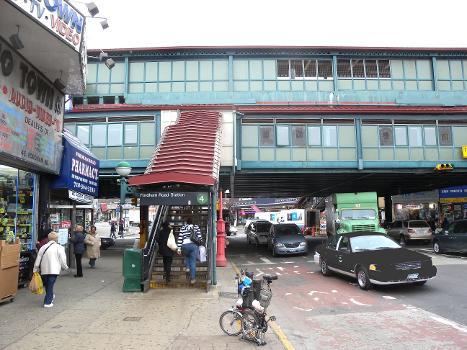 Looking west on East Fordham Road at IRT station on a cloudy midday