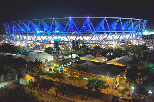 The Jawaharlal Nehru Stadium, the main stadium for the Delhi Commonwealth Games 2010 : Photo was taken on the night of the opening ceremony; security forces can be seen in the foreground.