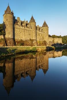 Josselin Castle : Taken from the bridge across the river Oust in Josselin on a very calm August evening. The château was lit with golden sunlight and reflected in the relatively still water.