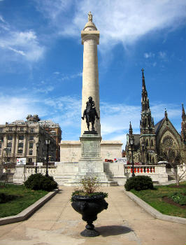 The (foreground) and (background) at Mount Vernon Place in Baltimore, Maryland.