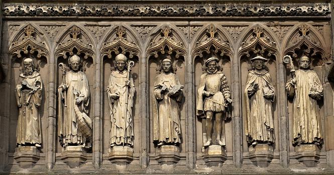 Detail from the Vaughan Porch of Leicester Cathedral:The seven statues are (left to right) of St Guthlac, St Hugh of Lincoln, Robert Grosseteste, John Wycliffe, Henry Hastings, William Chillingworth and William Connor Magee.