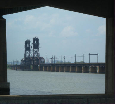 Lookng northwest from under Newark Bay Bridge Bayonne approach, at Lehigh Valley bridge on a hazy midday.