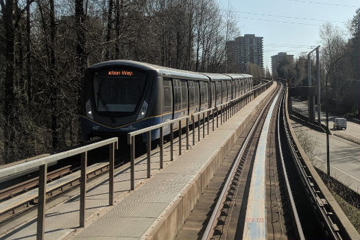 An Expo Line train traveling outbound towards Production Way–University station from Lougheed Town Centre station in Burnaby.