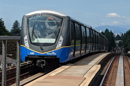 An Expo Line train traveling outbound towards Production Way–University station from Commercial–Broadway station in Vancouver. June 2019.