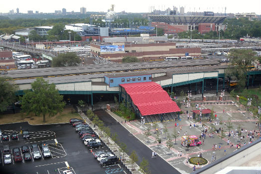 Looking southwest from top tier behind home plate of Citi Field on a cloudy afternoon.