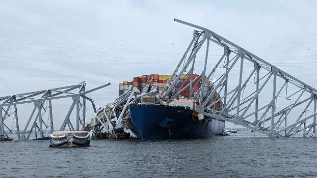 Francis Scott Key Bridge after collapse:Parts of the bridge collapsed onto the bow of the cargo ship Dali after it struck the southern pier supporting the main span of the bridge.