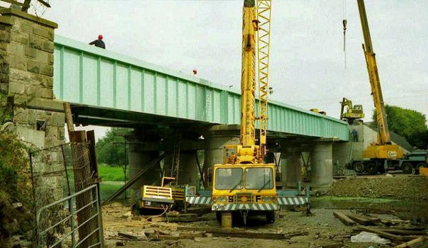 New railway bridge, Portadown. The old railway bridge, across the Bann, at Portadown dated from the early 1900's ie about 50 years after the line opened. It was replaced, in an operation lasting 14 days, with the present structure . In this photo (taken five days before the line re-opened) the new bridge is in place but further work was needed to make it usable.