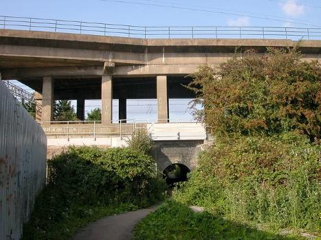 Newbold-The Black Path : The path passes under the two levels of the West Coast Mainline by means of a low tunnel.