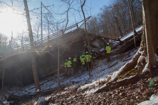 NTSB investigators at the scene of the Fern Hollow Bridge collapse