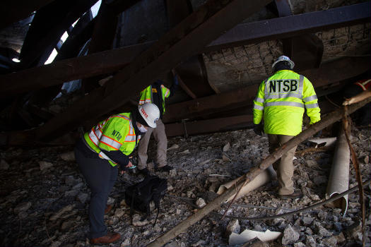 NTSB investigators beneath the collapsed Fern Hollow Bridge