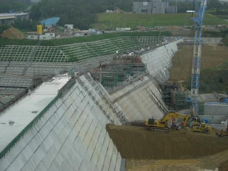 Downstream side of Okukubi Dam in July 2011 : The dam's spillway is still under construction