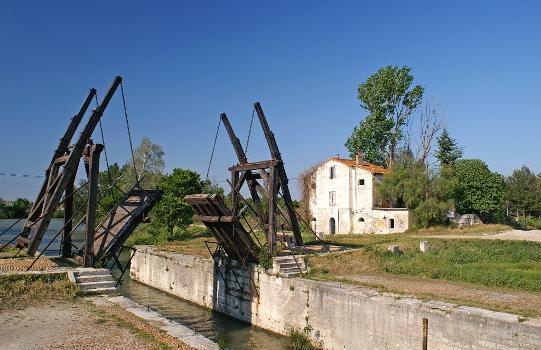 Replica of the Langlois bridge near Arles, France, which was painted by Van Gogh more than once : The replica is another bridge of same series, from Fos-sur-Mer, which was set up in 1962, two kilometers south of the original's location. It was completely restored in 1997.
The original bridge was popular under the name of its long-time keeper Langlois. Van Gogh misunderstood that name and interpreted it as l'Anglais. (Englishmen's bridge).