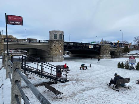 Pretoria Bridge : Skating under Pretoria Bridge - a stop along the Rideau Canal Skateway in Ottawa Canada. This is a table lift bridge in downtown Ottawa. The Rideau Canal Skateway is the worlds largest and longest skating rink at 8km.