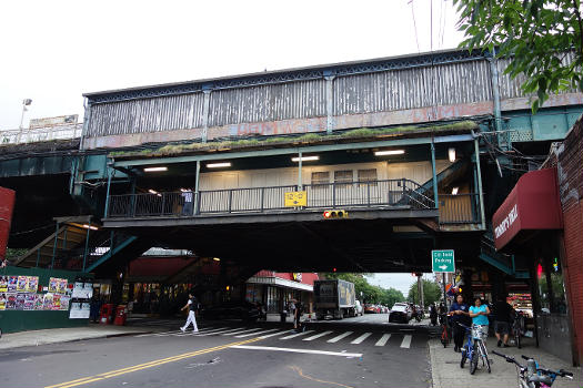 Looking north at the station house of the 111th Street IRT Flushing Line station, at Roosevelt Avenue and 111th Street in Corona, Queens. The station is in an unusual state of decay compared to the rest of the line.