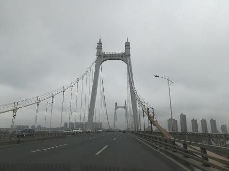 The Sanchaji Bridge is a suspension bridge in Changsha, Hunan, China : Completed on June 8, 2006, it has a main span of 732-metre (2,402 ft) and total length of 1,577-metre (5,174 ft). It is signed as part of the North Second Ring Road.