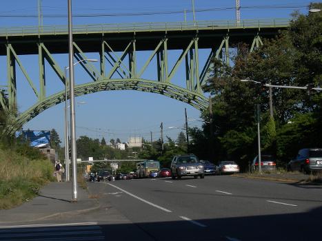 12th Ave S. Bridge (now Jose P. Rizal Bridge), on the National Register of Historic Places.:The bridge spans over Dearborn Street and connects First Hill, the Central District, and the International District on its north to Beacon Hill on its south. Looking east on Dearborn toward the bridge.